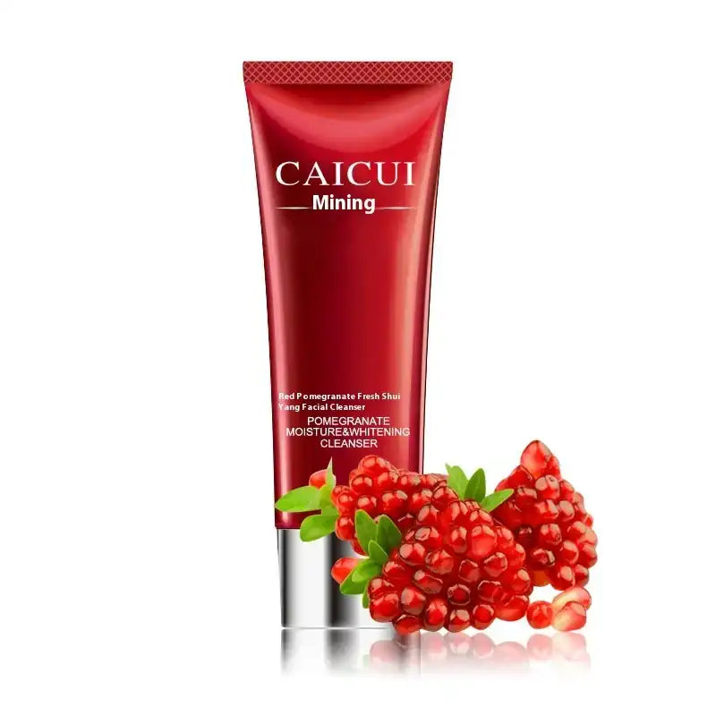 Red skincare product with pomegranate elements on a white background