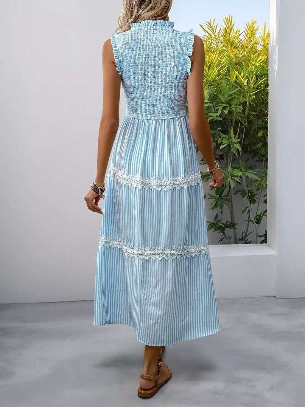 Blue striped sleeveless midi dress with lace trim and smocked back, perfect for summer outfits.
