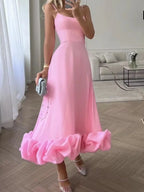 Pink ruffle hem midi dress with spaghetti straps, paired with sparkly heels and clutch for trendy women's fashion