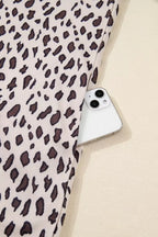 Leopard print fabric with a smartphone in the side pocket, stylish fashion detail