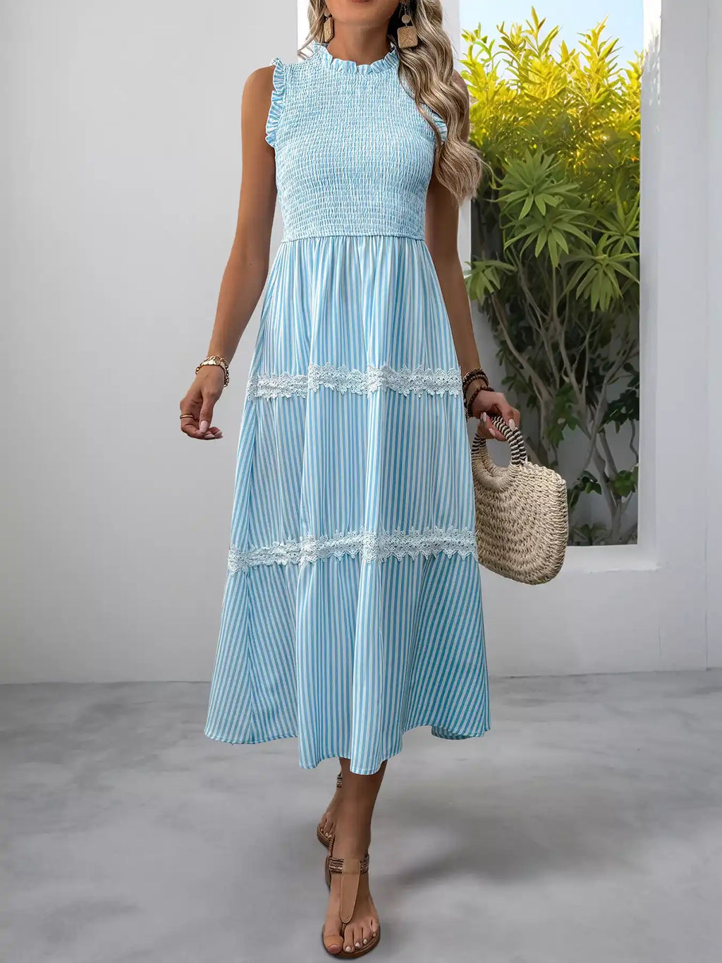 Light blue striped midi dress with lace trim, smocked bodice, and ruffle neckline for summer wear