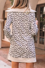 Woman wearing long sleeve leopard print tunic top with wide collar, outdoor setting