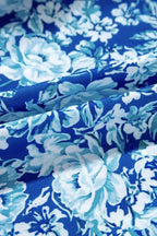Blue floral fabric with white and light blue botanical pattern, closeup texture