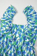 Blue floral print dress with ruffled sleeves and green accents on white fabric